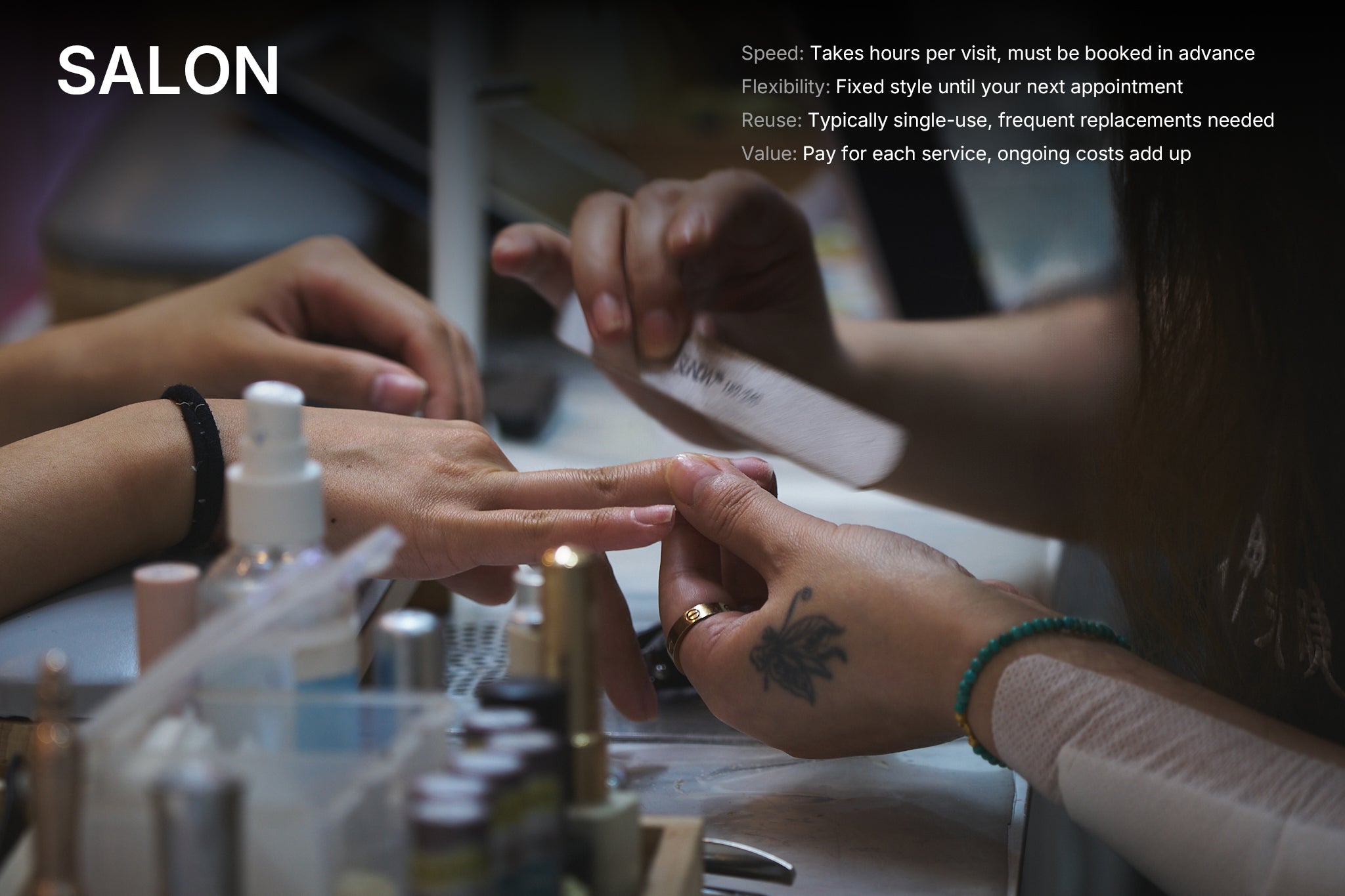 Nail technician filing customer’s nails during a manicure at a traditional salon, showcasing in-person salon service.