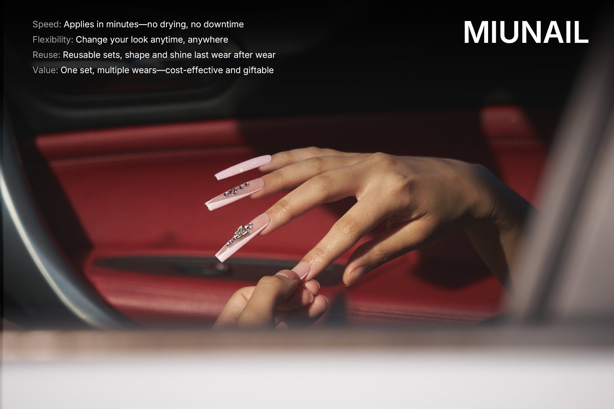 Person applying Sugar Flutter press-on nails with silver 3D accents inside a car, showcasing self-application and on-the-go nail styling.