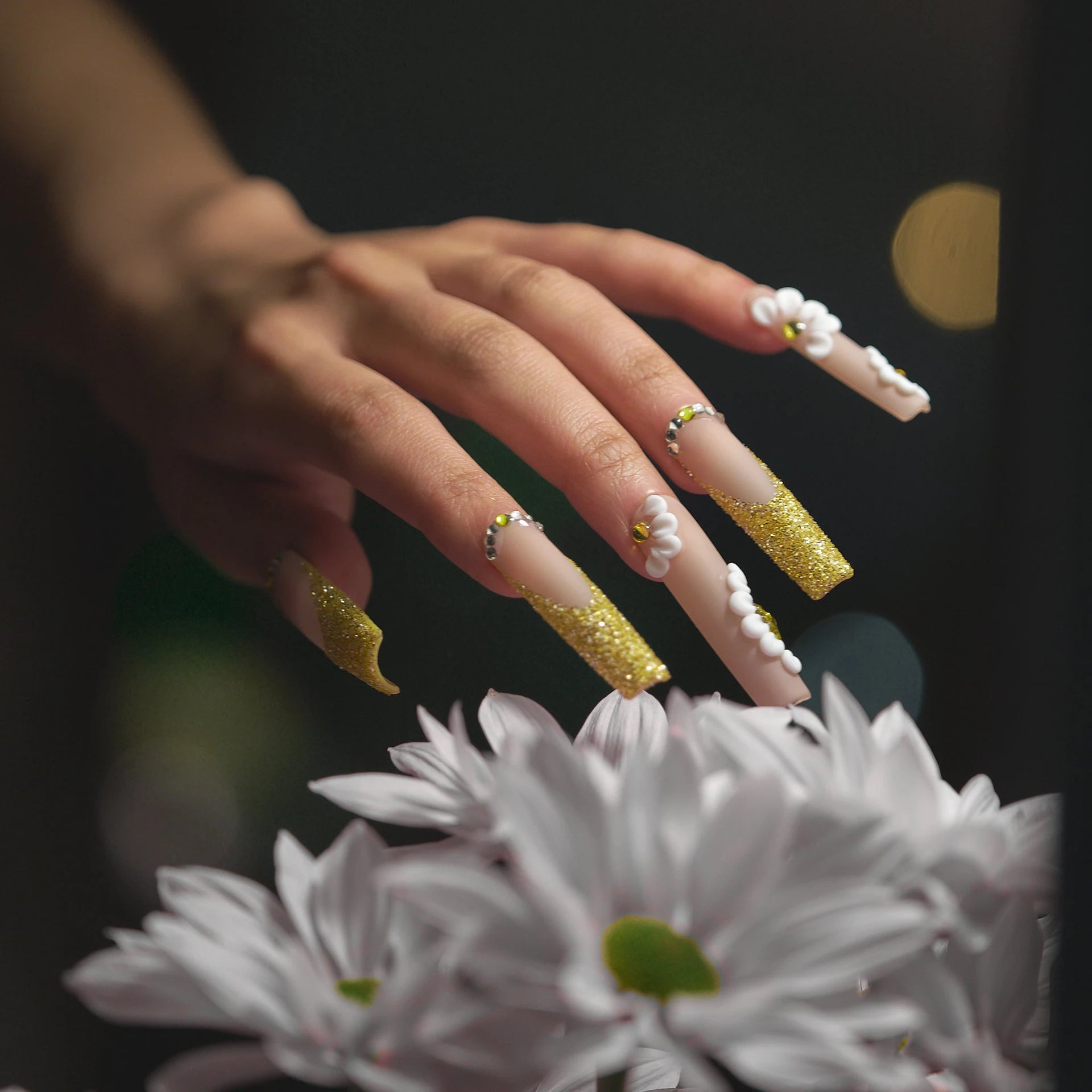 Cherish collection press-on nails, long nude coffin with yellow glitter tips and white daisies.