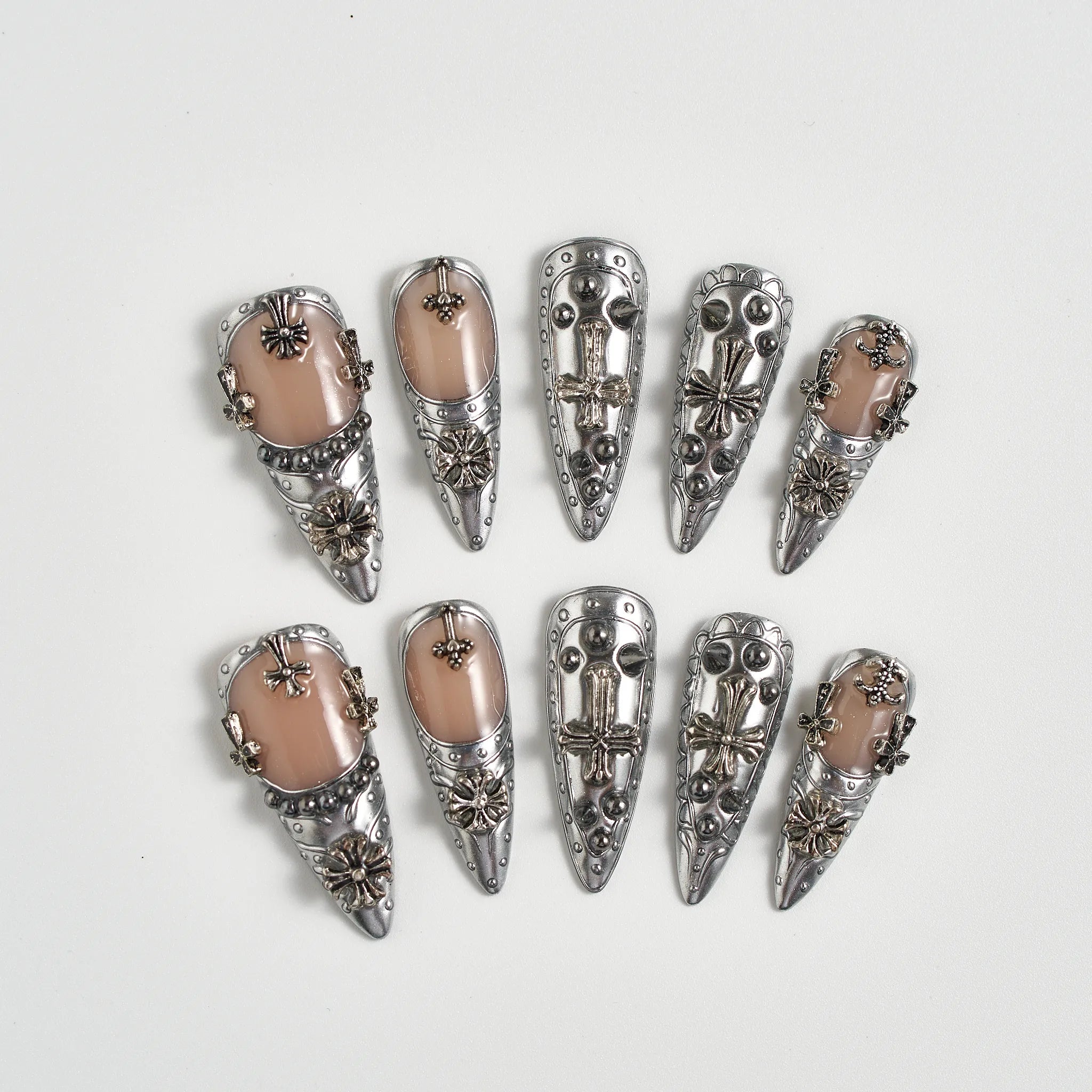 Set of silver hair clips with decorative elements on a white background