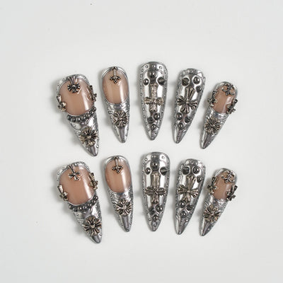 Set of silver hair clips with decorative elements on a white background