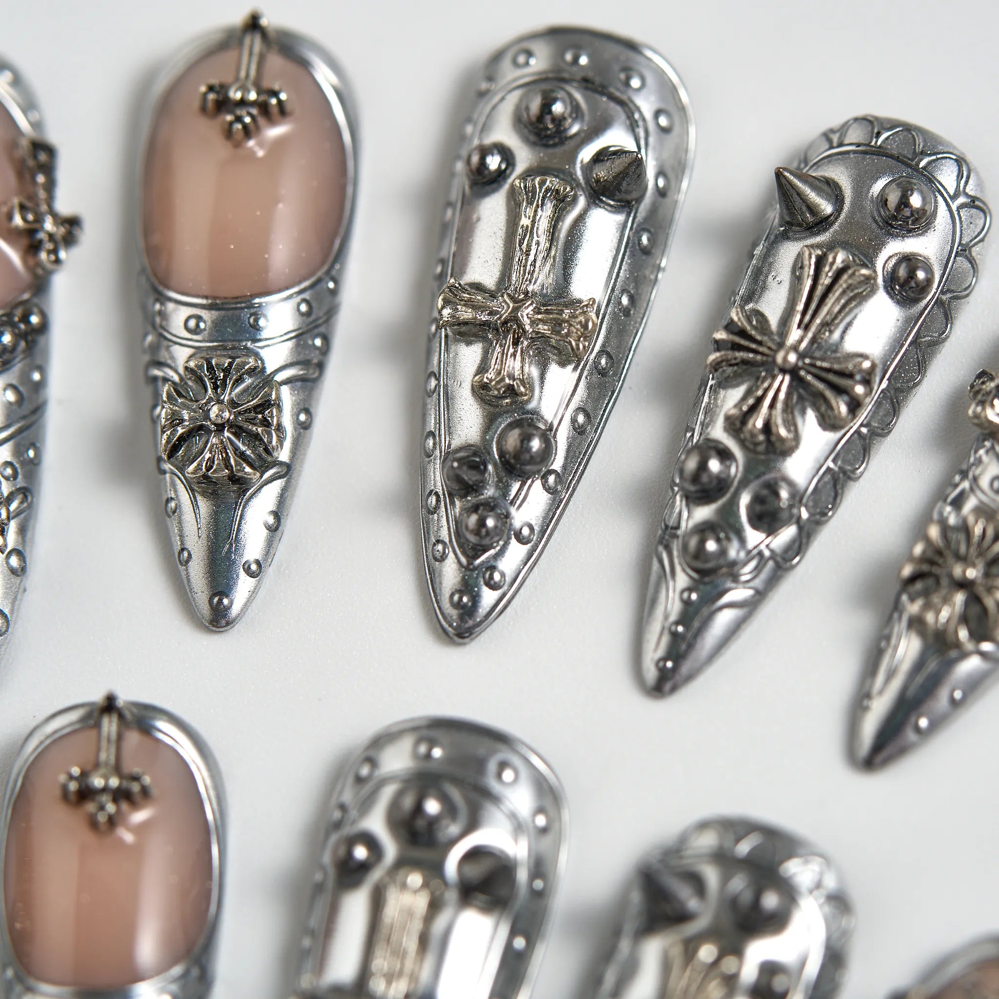 Decorative hair clips with intricate designs on a white background