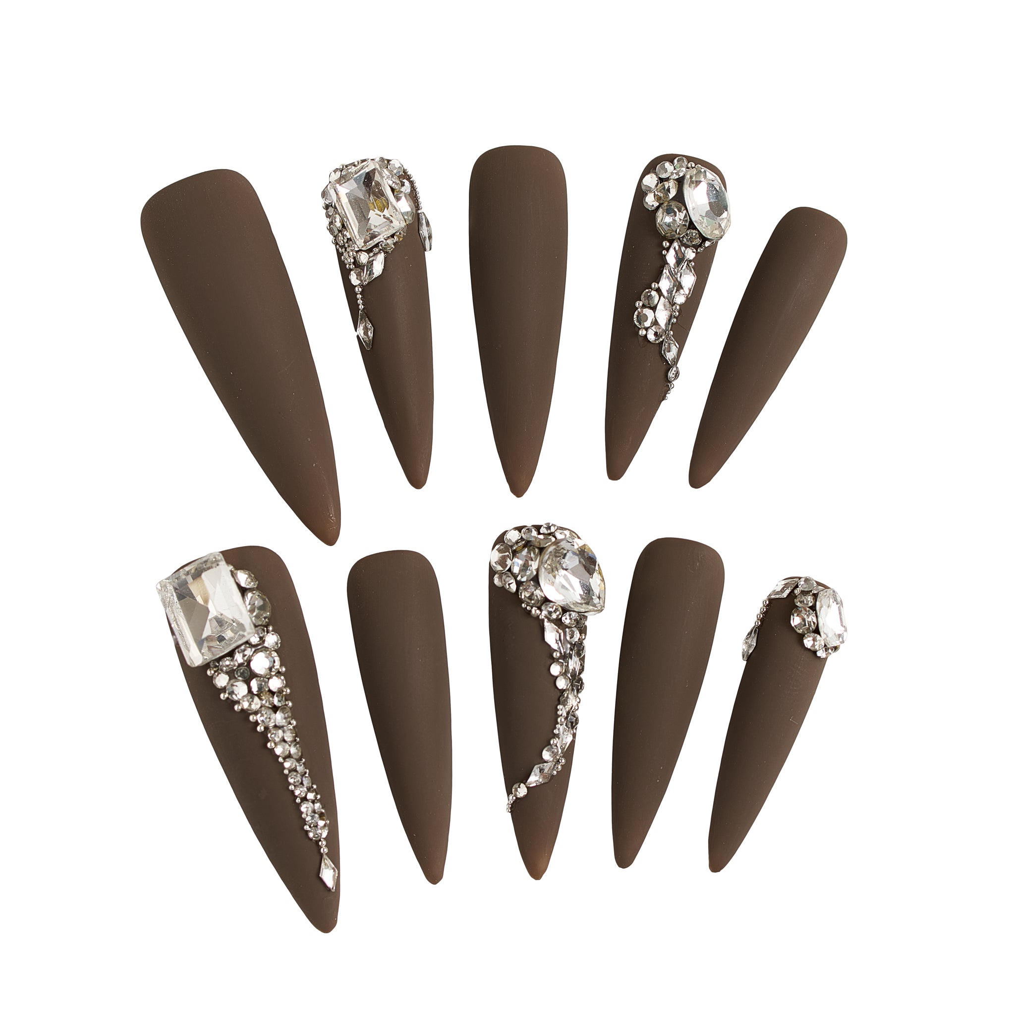 Set of long stiletto matte brown nails with rhinestone and crystal embellishments, displayed on a white background.