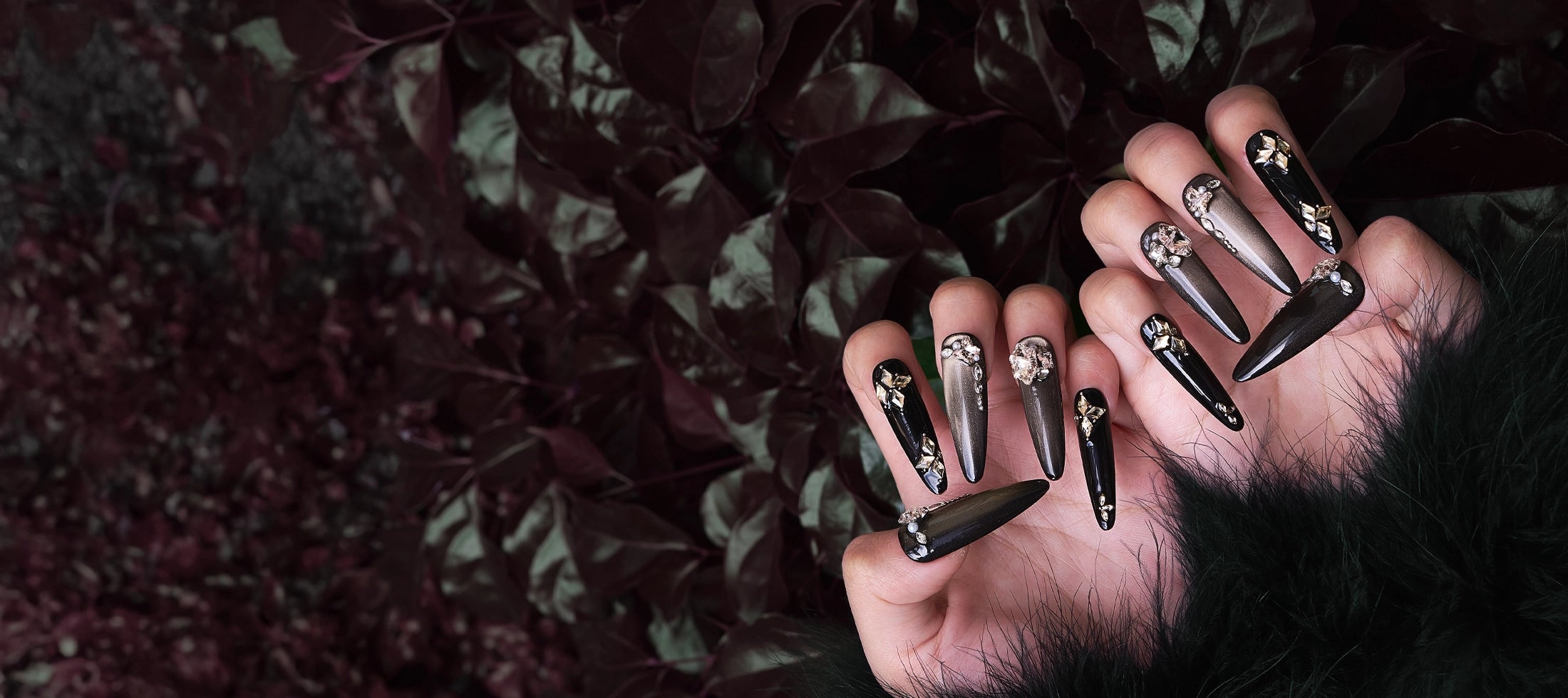 Close-up of MIUNAIL **reusable** 3D handmade press-on nails featuring a **velvet cat eye effect** with gothic black and gold designs. Intricate rhinestone embellishments and shimmering magnetic gel create a luxurious, salon-quality look.