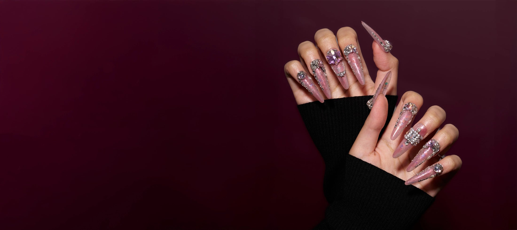 MIUNAIL **reusable** 3D handmade press-on nails featuring a **sheer rosy base with fine, scattered glitter**. The iridescent gloss finish creates a luminous glow, complemented by **crystal framing** and bold faceted stones that mimic **stacked jewellery rings** for a luxurious, feminine look