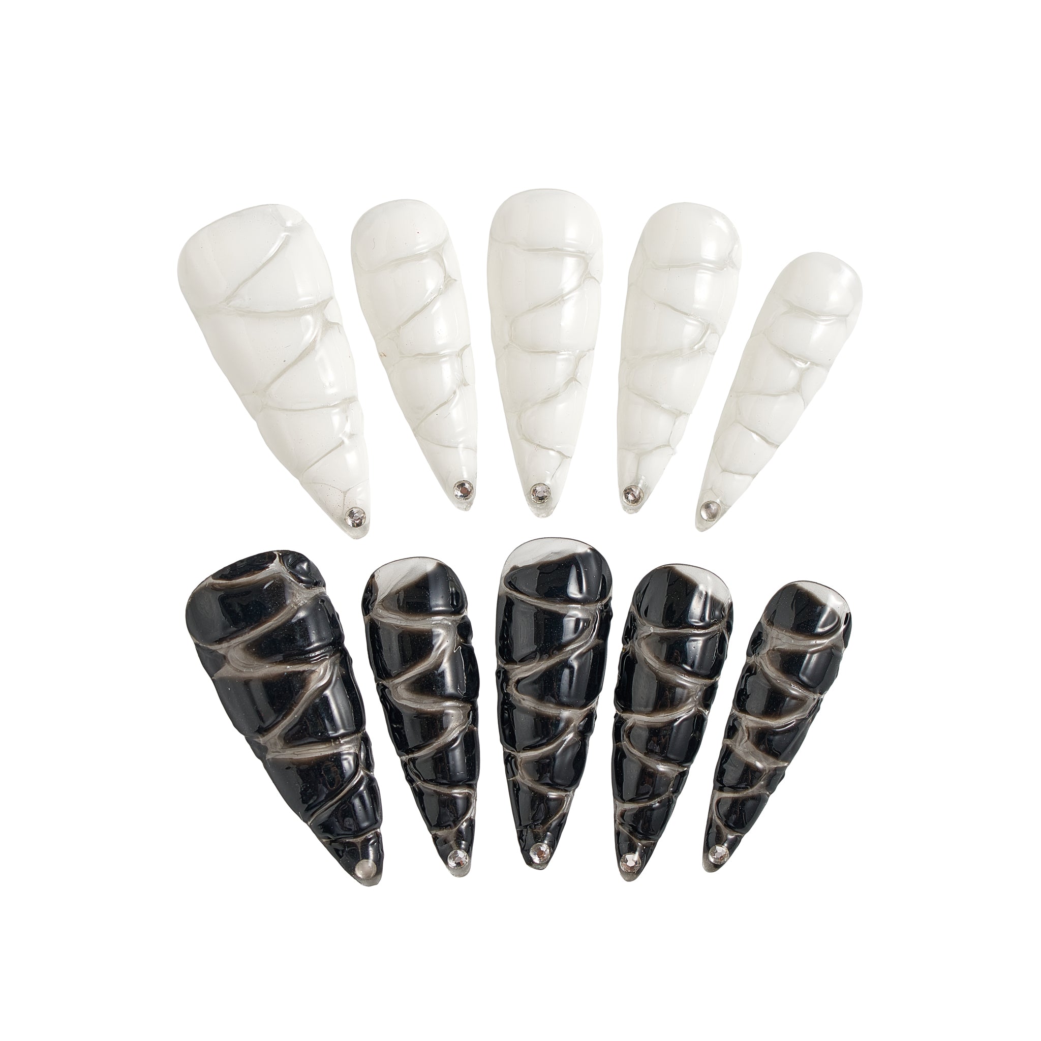 MiuNail Venom Twist press-on nail set featuring sculptural black and white spiral shells with metallic chrome tips, displayed on a white background.
