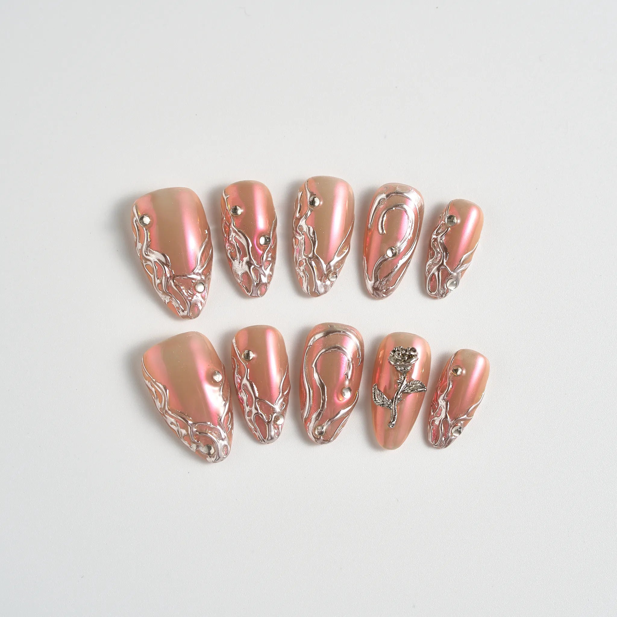 Set of decorative nail art designs on a light gray background