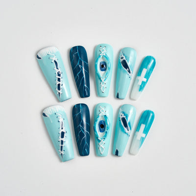 Set of blue and white nail art designs on a light gray background
