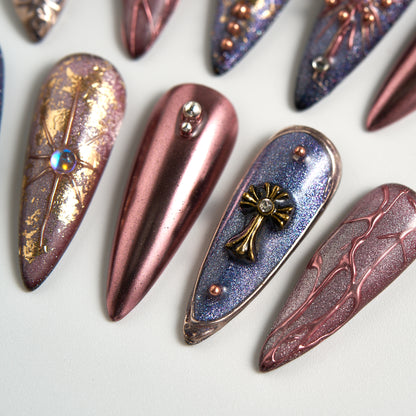 Violet Eclipse instant manicure set, salon-quality stiletto press-on nails in metallic purple and gold, white background